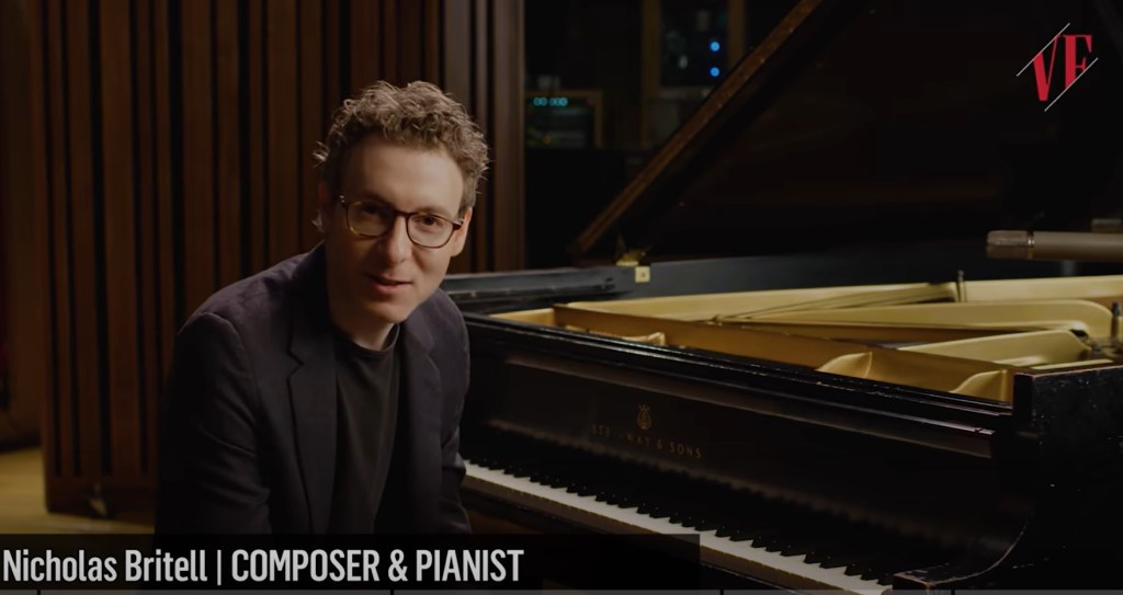Nicholas Britell sitting at a piano.